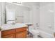 Bathroom featuring a shower-tub combo and a wood vanity at 11237 W Ford Dr, Lakewood, CO 80226