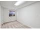 Finished basement bedroom with carpet, neutral paint, and window at 11237 W Ford Dr, Lakewood, CO 80226