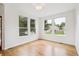 Bright room with hardwood floors, ample natural light from three large windows at 11237 W Ford Dr, Lakewood, CO 80226