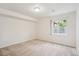 Finished basement bedroom with carpet, neutral paint, and a window at 11237 W Ford Dr, Lakewood, CO 80226