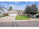Charming single-Gathering home with a well-manicured lawn, mature tree, and attached two-car garage at 11237 W Ford Dr, Lakewood, CO 80226