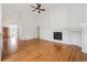 Spacious living room featuring hardwood floors, fireplace and vaulted ceilings at 11237 W Ford Dr, Lakewood, CO 80226
