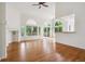 Open living room with hardwood floors, fireplace, vaulted ceilings and lots of light at 11237 W Ford Dr, Lakewood, CO 80226