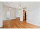 Spacious living room with hardwood floors, open layout, and stylish lighting at 11237 W Ford Dr, Lakewood, CO 80226