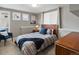 Inviting bedroom featuring a comfortable bed, stylish decor, and bright windows creating a cozy atmosphere at 1039 Leonard Ln, Louisville, CO 80027