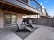 Relaxing patio area with modern Adirondack chairs and stylish rug, creating an inviting outdoor living space at 1039 Leonard Ln, Louisville, CO 80027