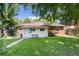 The backyard features a well-maintained lawn and pathway leading to the back entrance at 2635 Julian St, Denver, CO 80211