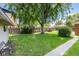 Lush backyard with mature tree and wooden fence at 2635 Julian St, Denver, CO 80211