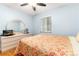 Inviting bedroom with hardwood flooring, a dresser, and soft natural light at 2635 Julian St, Denver, CO 80211