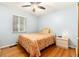Comfortable bedroom with a cozy bed, hardwood floors, and natural light at 2635 Julian St, Denver, CO 80211