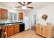 Charming kitchen with oak cabinets, green countertops, and modern appliances at 2635 Julian St, Denver, CO 80211