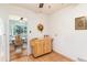 Kitchen featuring an adjacent dining area and a portable island with wood cabinets at 2635 Julian St, Denver, CO 80211