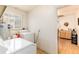 Laundry room with washer, dryer, and view to hallway at 2635 Julian St, Denver, CO 80211