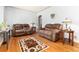 Cozy living room featuring hardwood floors, comfortable seating, and plenty of natural light at 2635 Julian St, Denver, CO 80211