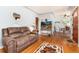 Bright and airy living room featuring wood flooring and neutral wall paint at 2635 Julian St, Denver, CO 80211