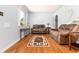 Inviting living room featuring gleaming hardwood floors, neutral paint, and ample natural light at 2635 Julian St, Denver, CO 80211