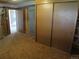 A basement with carpet, closets and multiple doors at 827 Hannibal Dr, Aurora, CO 80011