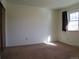 Comfortable bedroom with carpet and a window offering natural light at 827 Hannibal Dr, Aurora, CO 80011