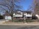 Charming two-story home with a brick-accented facade and a well-maintained front yard at 827 Hannibal Dr, Aurora, CO 80011