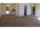 Spacious living area with a view of the kitchen and a connecting hallway at 827 Hannibal Dr, Aurora, CO 80011