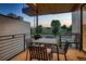 Outdoor dining set and grill on a private deck, perfect for entertaining or enjoying al fresco meals at 3232 W 16 Ave, Denver, CO 80204