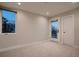 Inviting bedroom features lots of natural light, complemented by plush carpeting and a calm color palette at 3232 W 16 Ave, Denver, CO 80204
