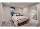 Cozy bedroom with a bed, a window, and a view to a bathroom at 3232 W 16 Ave, Denver, CO 80204