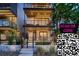 Modern home exterior featuring multiple balconies, sleek design, and a secure, gated front entrance at 3232 W 16 Ave, Denver, CO 80204