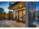 Exterior view showcasing sliding glass doors leading to a home office space with ample natural light at 3232 W 16 Ave, Denver, CO 80204
