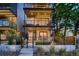 Modern exterior with multiple balconies, clean lines, and a well-maintained front yard with landscaping at 3232 W 16 Ave, Denver, CO 80204