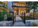 Modern home featuring a gated front yard, architectural details, and an inviting entrance at 3232 W 16 Ave, Denver, CO 80204