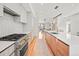 Stylish kitchen featuring stainless steel appliances, ample counter space, and a view into the living area at 3232 W 16 Ave, Denver, CO 80204