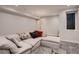 Cozy living room with a plush sectional sofa, providing a comfortable and inviting gathering space at 3232 W 16 Ave, Denver, CO 80204