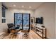 Living room with floor to ceiling windows and modern furniture at 3232 W 16 Ave, Denver, CO 80204