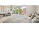 Serene main bedroom with natural light, patio access, and neutral tones for a calm, inviting space at 3232 W 16 Ave, Denver, CO 80204