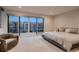 Comfortable main bedroom with private balcony access, offering outdoor views and abundant natural light at 3232 W 16 Ave, Denver, CO 80204