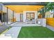 Inviting front patio with modern seating, manicured lawn, and a sleek, contemporary design at 3232 W 16 Ave, Denver, CO 80204