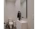 Modern powder room with floating vanity, sleek fixtures, and a minimalist design that is both stylish and functional at 3232 W 16 Ave, Denver, CO 80204