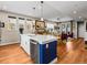 Spacious kitchen with a large island, stainless steel dishwasher, and an open view into the living area at 6162 W 28Th Ct, Wheat Ridge, CO 80214
