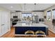 Bright, open kitchen with a large island, stainless steel appliances, and modern white cabinets at 6162 W 28Th Ct, Wheat Ridge, CO 80214