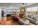 Open-concept living and kitchen area with hardwood floors and stylish decor, with an eat-in table at 6162 W 28Th Ct, Wheat Ridge, CO 80214