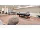 Basement recreational room with comfortable seating, a pool table, and plenty of space for entertainment at 7172 S Oakleaf St, Bennett, CO 80102