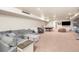 Recreational space includes sofa, game table and ample room at 7172 S Oakleaf St, Bennett, CO 80102