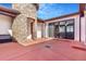 Charming courtyard view featuring a stone turret and seamless indoor-outdoor transitions at 7172 S Oakleaf St, Bennett, CO 80102