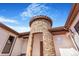 Unique stone turret design at the front entrance adds architectural charm and character at 7172 S Oakleaf St, Bennett, CO 80102