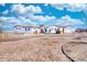 Charming single-story home features a stucco exterior, red tile roof, circle driveway, and gravel landscaping at 7172 S Oakleaf St, Bennett, CO 80102