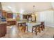 Large kitchen island with barstool seating and granite countertops, great for food preparation and casual dining at 7172 S Oakleaf St, Bennett, CO 80102