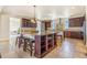 Spacious kitchen island with bar stools, perfect for Gathering gatherings and everyday meal preparation at 7172 S Oakleaf St, Bennett, CO 80102