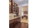 Gourmet kitchen with granite counters, wood cabinets, and stainless steel appliances at 7172 S Oakleaf St, Bennett, CO 80102