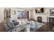 Inviting living room with fireplace, sliding door to patio and hardwood floors at 7172 S Oakleaf St, Bennett, CO 80102